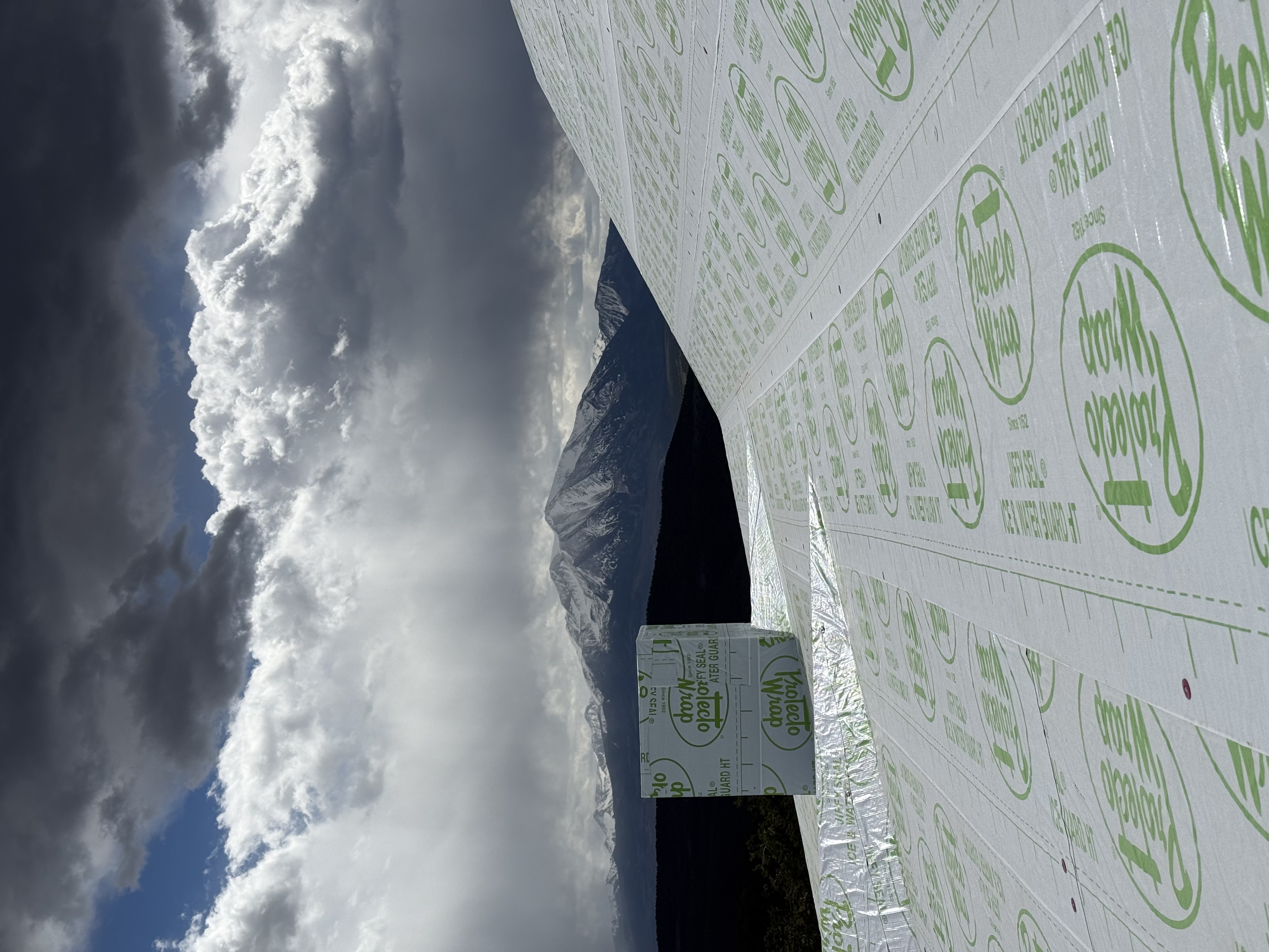 Roof underlayment with mountain backdrop